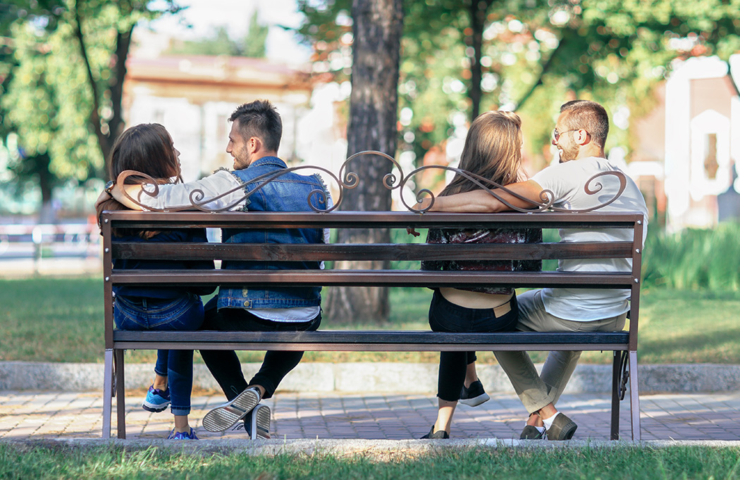 two couples on a bench